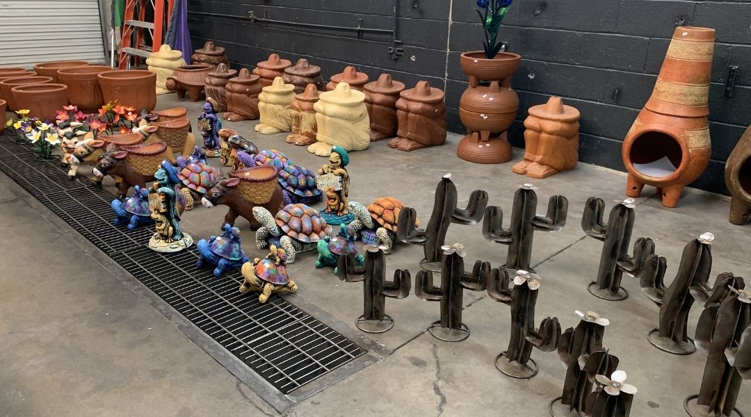 Various metal and clay objects for sale at Pottery Fiesta in Tucson