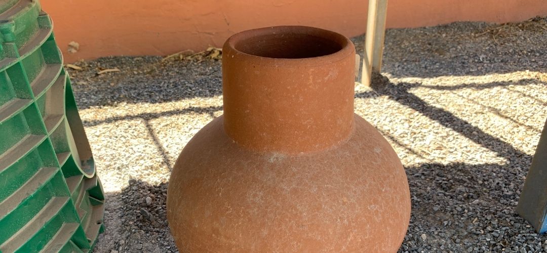 A clay pot known as an olla or garden olla, for sale at a Tucson garden center