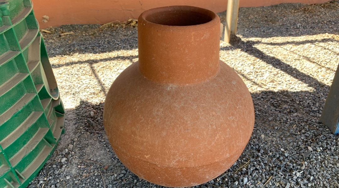 A classic looking garden olla with a round base and narrow top 